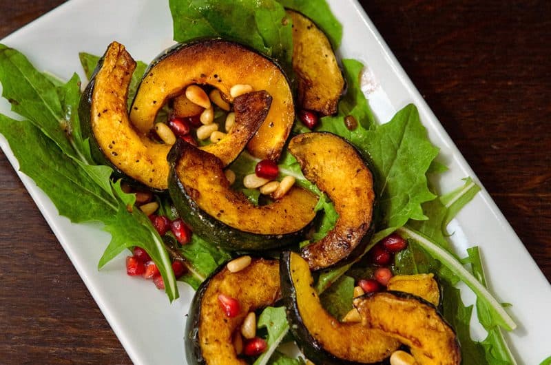 Dandelion Salad with Pomegranate Seeds, Pine Nuts, and Roasted Delicata Squash