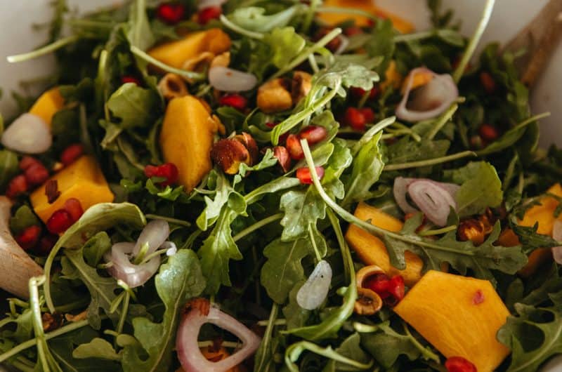 Persimmon and Pomegranate Salad with Arugula and Hazelnuts